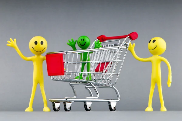 Happy family with shopping cart Stock Picture