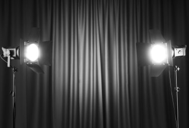 Curtains and projector lights wtih space for your text clipart