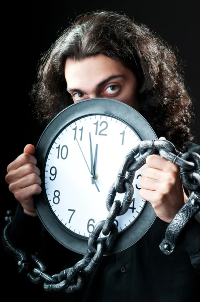 Man chained to the clock — Stock Photo, Image