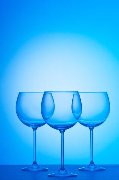 Wine glasses against gradient background