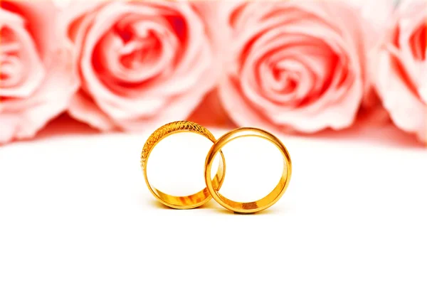 Wedding concept with roses and rings Stock Picture