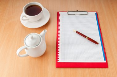 Binder with blank page and tea clipart