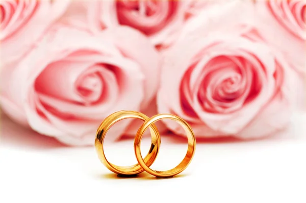 Wedding concept with roses and rings Royalty Free Stock Images