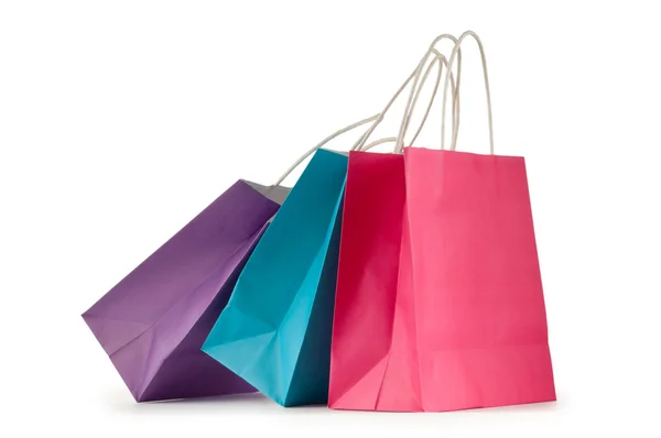Bolsas de compras de papel de colores aisladas en blanco Fotos De Stock