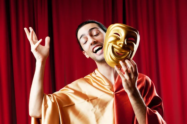 Actor with maks in a funny theater concept Stock Image
