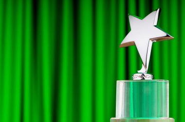 Star award against curtain background clipart