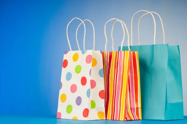 stock image Shopping bags against gradient background