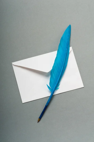 Letter and feather on the background — Stock Photo, Image