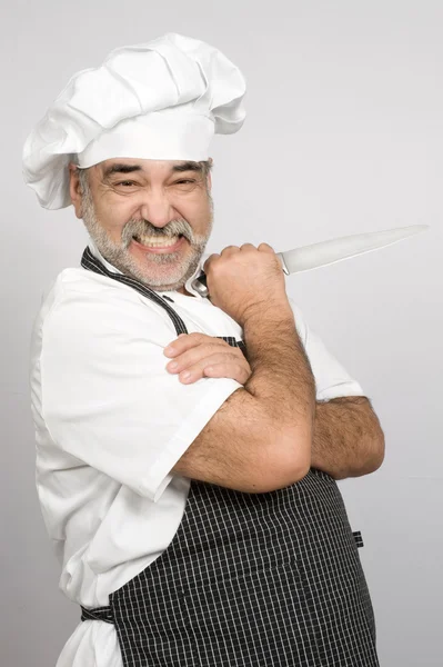 Atractivo chef con cuchillo —  Fotos de Stock