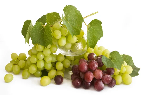 Isolated green and red grape with leaves Stock Photo