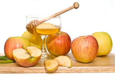 Isolated honey with ripe fresh apple for Rosh Hashana clipart