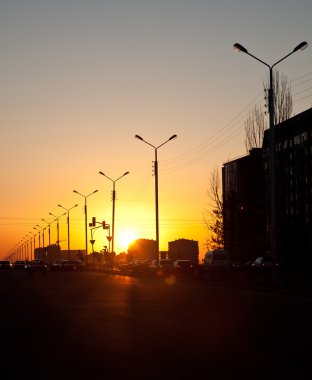 Urban sunset on the highway