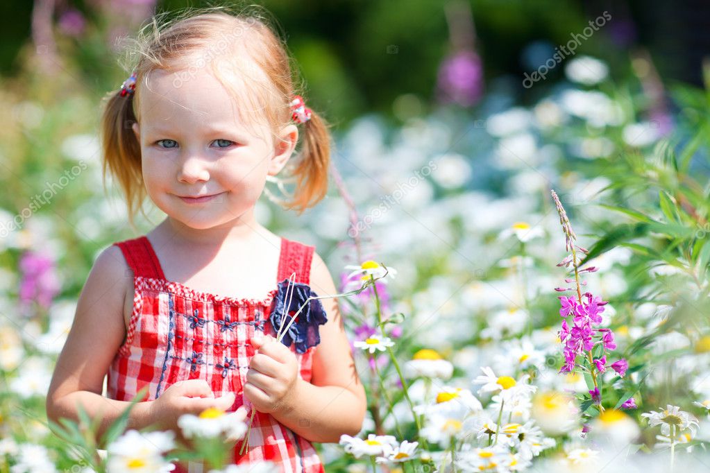 Little Girl In Meadow — Stock Photo © Shalamov #6119004