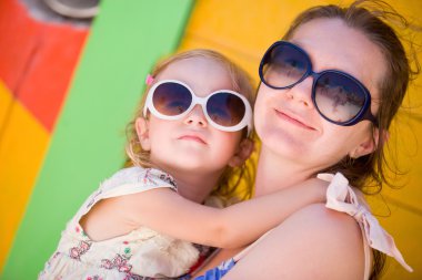 Mother and daughter at Caribbean vacation clipart