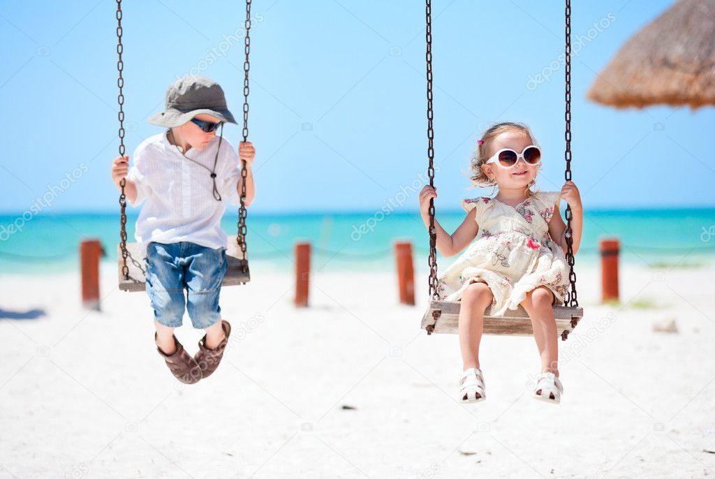 Little kids swinging