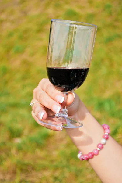 stock image Woman holding glass of wine