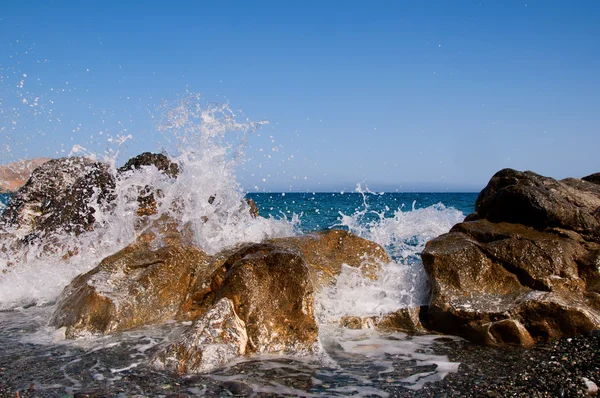 Sea surf wave closeup break on stone — Stock Photo, Image