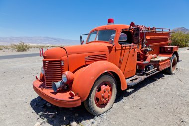 Red vintage firefigther's truck clipart