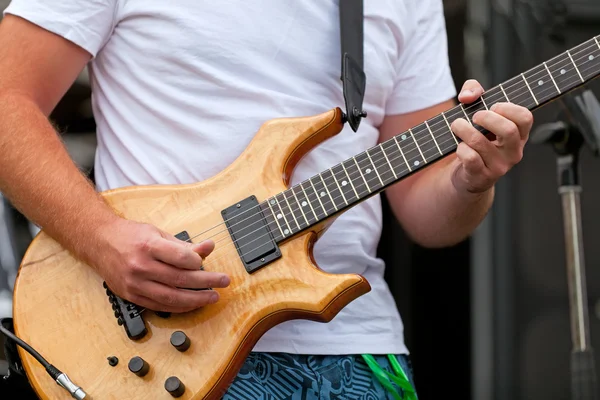 stock image Male guitar player performing song