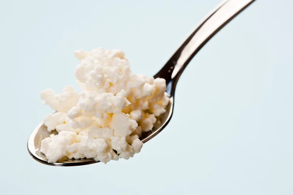 Spoon with cottage cheese — Stock Photo, Image
