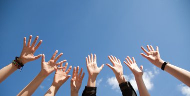 Hands rised up in air across sky clipart