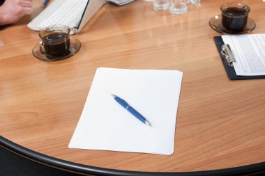 Pen and paper on table clipart