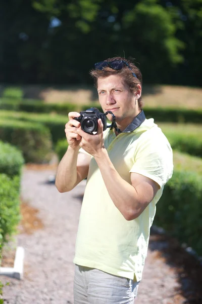 Fotograaf in park — Stockfoto