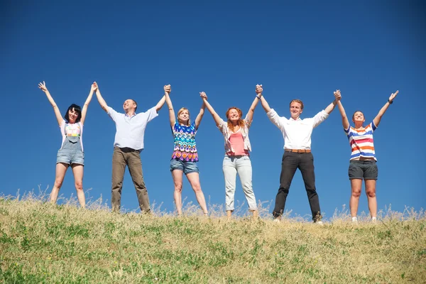 On hill raise hands together — Stock Photo, Image