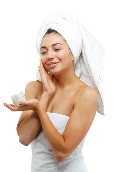 Beautiful women applying moisturizer cosmetic cream on face. — Stock Photo, Image
