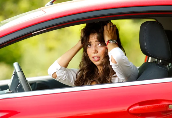 Young pretty woman in the red car — Stock Photo, Image