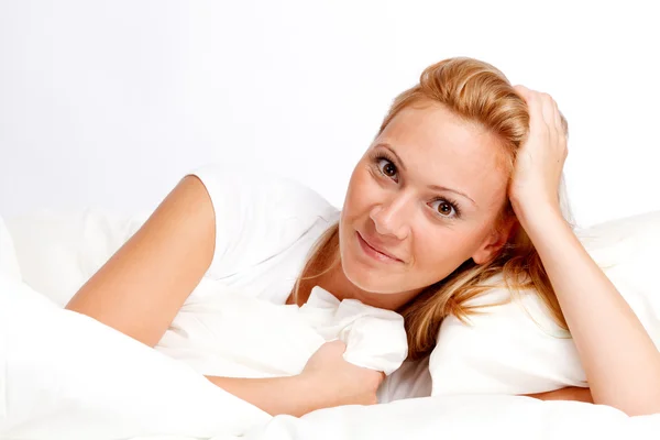 Young woman in bed — Stock Photo, Image