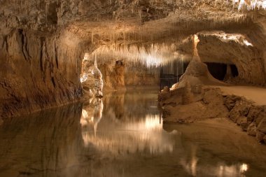 Underground lake in a grotto clipart