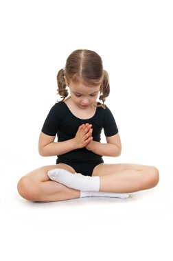 Girl in the lotus position. Children's yoga. clipart