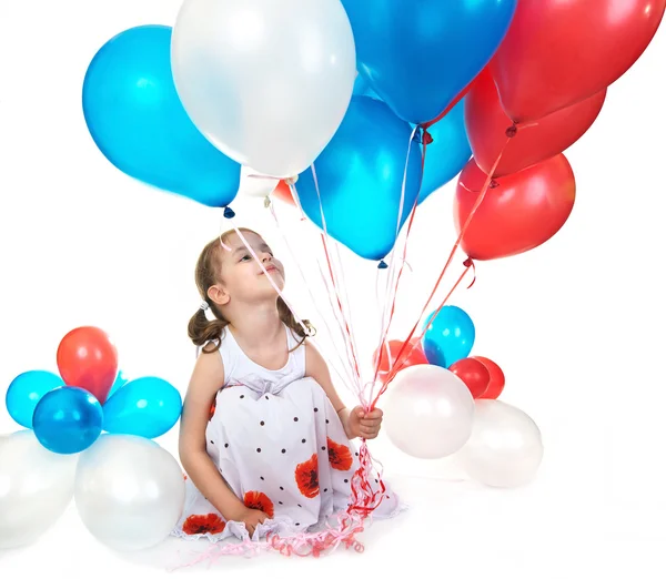 Liten flicka med ballonger. — Stockfoto