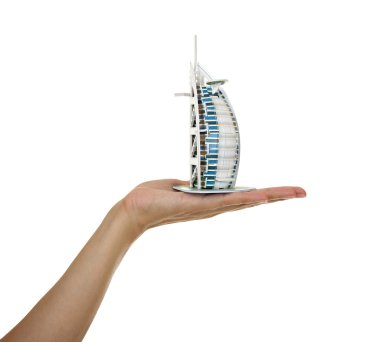 Model Burj al Arab in the womens hand. clipart