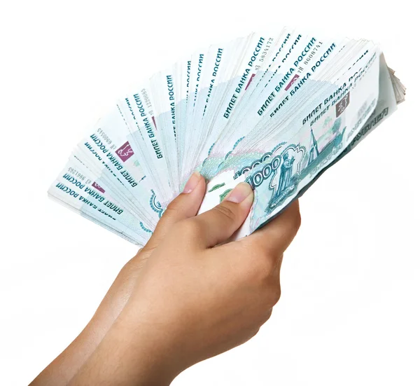 Balíček jednu tisícinu bankovek v ženské ruce. — Stock fotografie