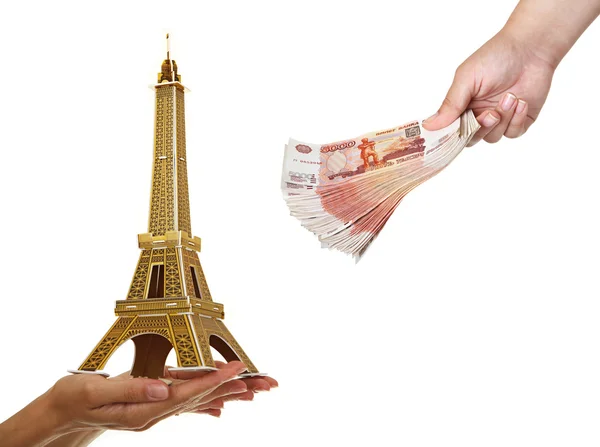 Model Eiffel Tower and a pack of five thousandth of notes in wom — Stock Photo, Image