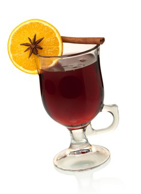 Hot mulled wine with orange slice, anise and cinnamon clipart