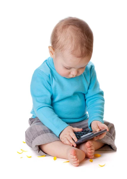 Small baby playing with calculator — Stock Photo, Image