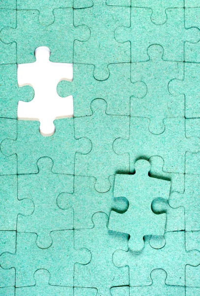 Green puzzle with missing piece — Stock Photo, Image