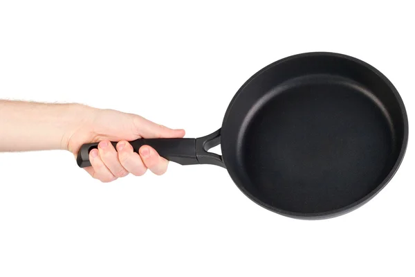 Frying pan in a hand isolated on white background — Stock Photo, Image