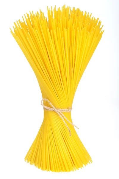 Bunch of spaghetti tied up with ribbon isolated on white — Stock Photo, Image