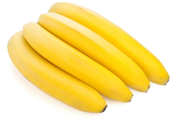 Zralé banány na bílém pozadí — Stock fotografie