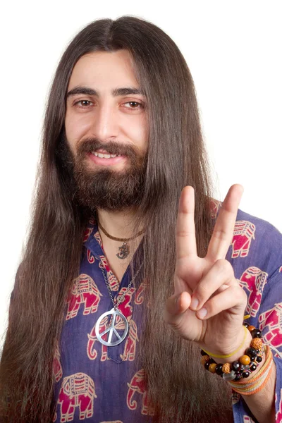 stock image Friendly hippie with long hair making peace sign