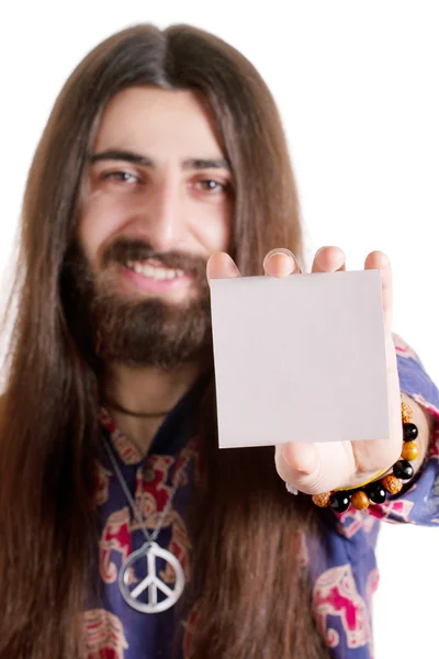 Long-haired hippy man holding blank paper card — Stock Photo, Image