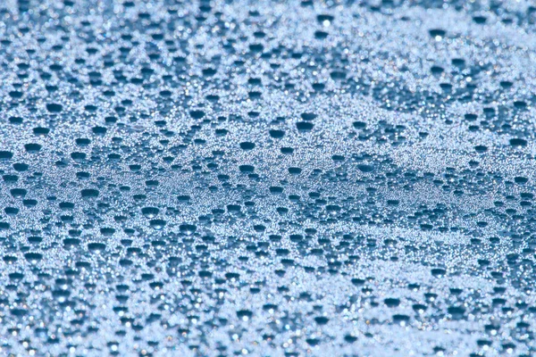 Kapky vody na pozadí šedá modrá — Stock fotografie