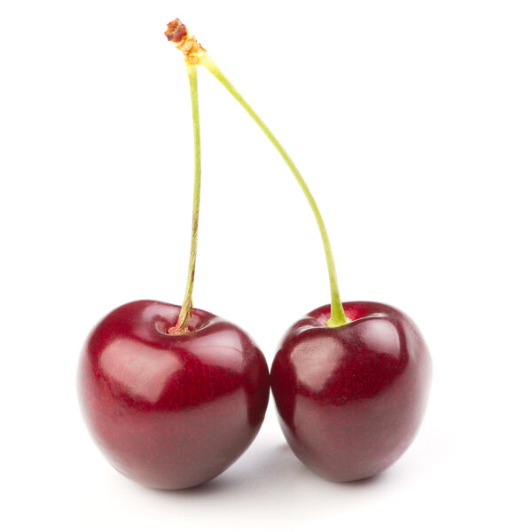 Red ripe cherries over white background