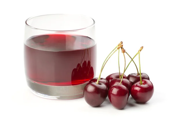 stock image Cherries and a glass of cherry juice isolated on white