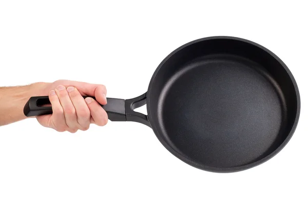 Frying pan in a hand isolated on white background — Stock Photo, Image