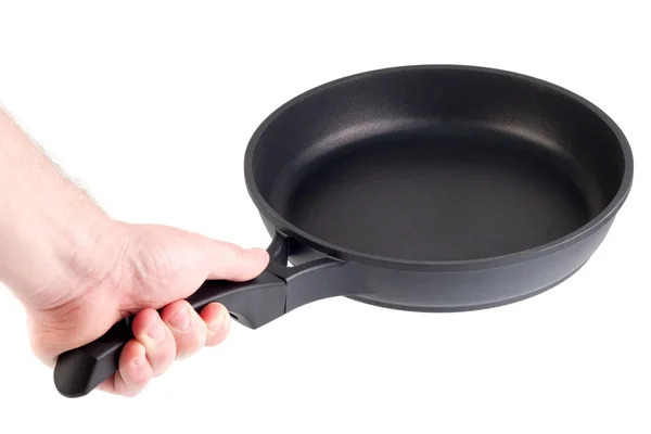 Frying pan in a hand isolated on white — Stock Photo, Image